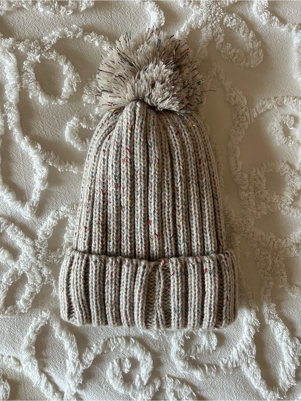 Beige knit hat with pompom, plush lining, NWOT